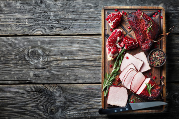 Wall Mural - smoked barbecue meat tenderloin on a wooden board