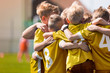 © matimix - Kids Soccer Football Team Huddle. Children Play Sports Game. Children Sporty Team United Ready to Play Game. Youth Sports For Children. Boys in Sports Jersey Shirts. Young Boys in Soccer Sportswear