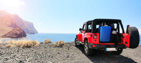 Sticker - Red summer car on road and free space for your decoration. 