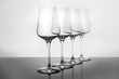 Row of empty wine glasses on white background