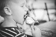 © yuriy - child eats popsicle ice cream silver wrap