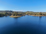 Fototapeta Storczyk - Aerial view of Miramar reservoir in the Scripps Miramar Ranch community, San Diego, California. Miramar lake, popular activities recreation site including boating, fishing, picnic & 5-mile-long trail.