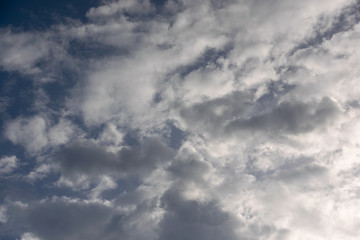 dark blue sky with white clouds