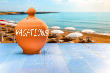 Wall Mural - Vacations Money box, beach background