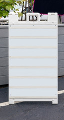 Wall Mural - Free standing promotional sign with copy space in local neighborhood parking lot.