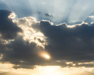 dramatic sky with clouds and rays of light sun