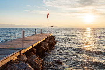 Wall Mural - Summer sunrise on coast, Corfu island, Greece. Beach with perfect views of the mainland Greece mountains.