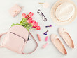 Flat lay with girls spring summer accessories in pink pastel tones. Casual urban summer style