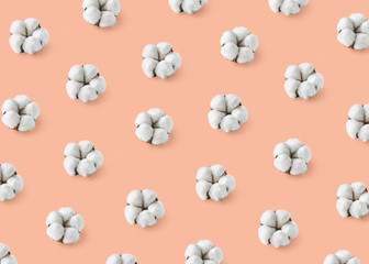 Wall Mural - Pattern of cotton flowers on orange pastel background