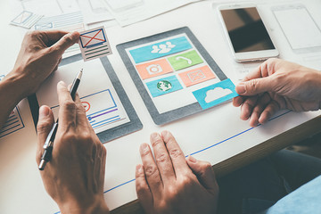 Wall Mural - Creative Web Designer planning application and developing template layout, framework for mobile phone. User experience (UX) concept.