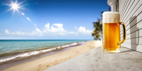 Sticker - Cold tasty beer on beach bar and sea landscape. Free space for your decoration. 