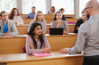 © Nejron Photo - Lecturer and multinational group of students in an auditorium