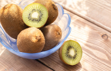 Tasty ripe kiwi on table