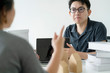 asian glasses man stress arguing with co worker in meeting room office background