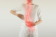 Pain in the spine, a woman with backache