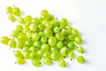 green gooseberry on white background close-up. ripe gooseberry berries on the table.