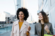 © Westend61 - Two happy women with shopping bags in the city