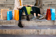 © Westend61 - Two women with shopping bags sitting on stairs checking the purchase