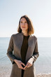 © Westend61 - Confident woman standing at the sea
