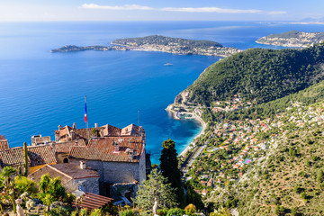 Scenic view of the Mediterranean coastline and medieval houses from the top of the town of Eze village on the French Riviera