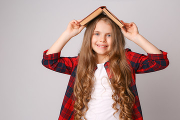  schoolgirl with books and globe on white background