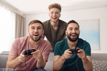 Wall Mural - Emotional friends playing video games at home