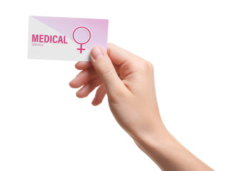 Wall Mural - Girl holding medical business card isolated on white, closeup. Women's health service