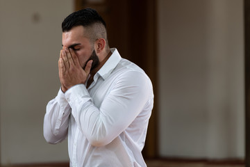 Wall Mural - Young Business Man Muslim Praying