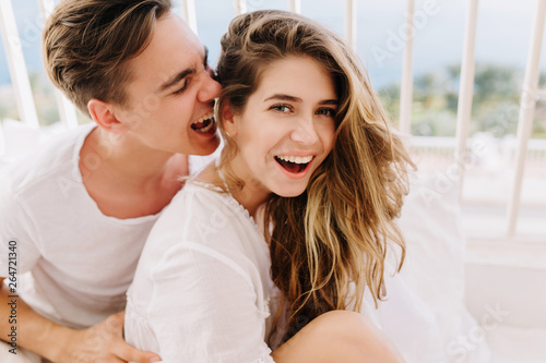 Cheerful Laughing Girl With Trendy Hairstyle Having Fun With