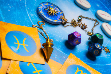 Wall Mural - esoteric fortune teller tools - magic pendulum, runes, zodiac pendant, astrology dice and zodiac sym