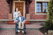 © Тарас Нагирняк - caring nurse and senior man in wheelchair on walking green nature!