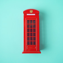 London Red Telephone Booth On Blue Background.