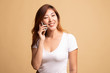 © halfbottle - Young Asian woman talking with mobile phone.