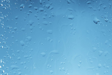 Wall Mural - wet glass background condensate / abstract rain, drops texture on transparent glass