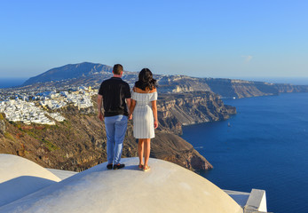 A young couple looking at the sea