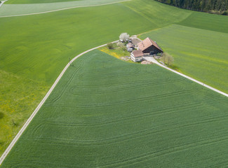 Wall Mural - Aerial view of farm house in Switzerland.