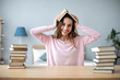 © BestForYou - Young beautiful woman with books at the table.