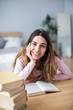 © BestForYou - Girl student reads books at home.