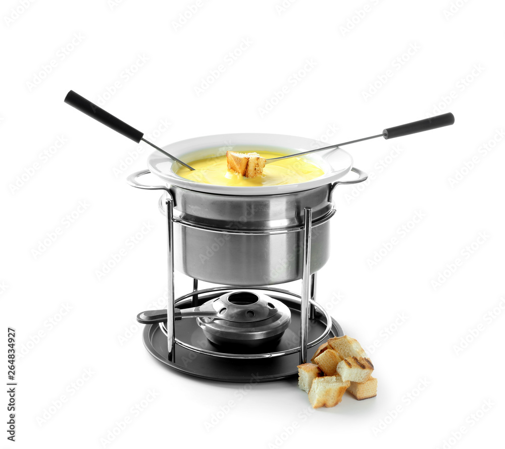 Fondue pot with melted cheese and bread on white background