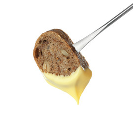 Fondue stick with cheese covered piece of bread on white background