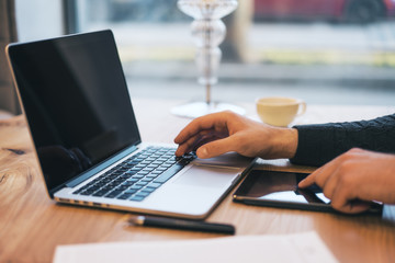 Poster - man using empty laptop screen on desktop