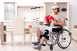 © Elnur - Injured young man doing exercises at home