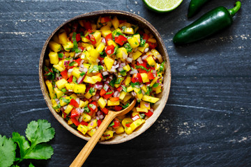 Wall Mural - Mango salsa in coconut bowl