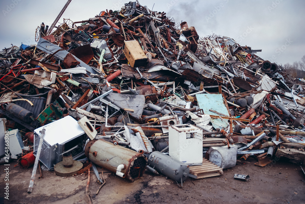 Heap of metal items on a scrap yard in Warsaw, capital city of Poland - obrazy, fototapety, plakaty 