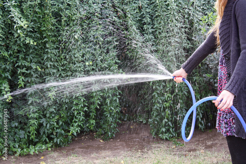 Persona Regando Plantas Con Una Manguera Buy This Stock Photo And Explore Similar Images At Adobe Stock Adobe Stock