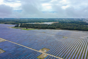 Wall Mural - Aerial stock photo solar power farm landscape