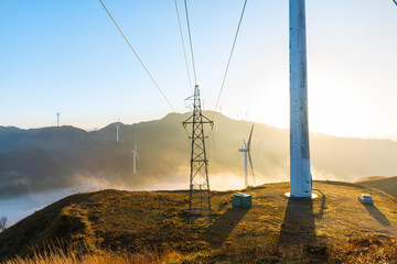 The mountain high voltage and wind power in the sea of clouds, sunrise and sunset