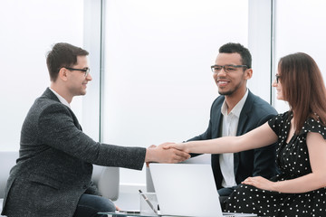 Wall Mural - handshake of business partners after discussing a new joint project.