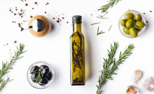 Fresh Olives, Herbs And Oil In Bottle Composition