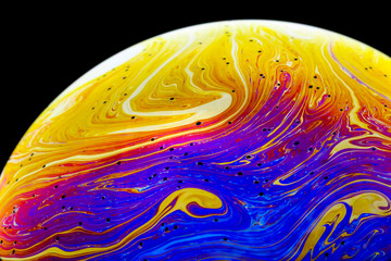 Wall Mural - multicolored rainbow colors of a single soap bubble that looks like a fantasy planet isolated agains